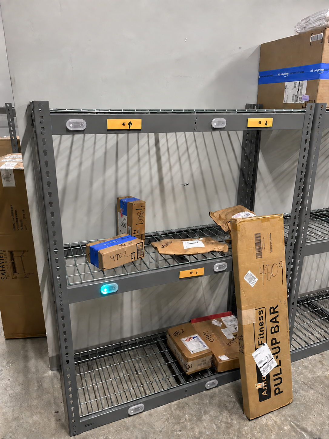 EZ Lockers pick-to-light shelf holding apartment packages